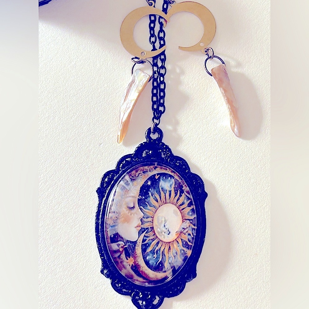 Necklace The Sun, The Lady in a Crescent Moon, & Stars picture 2” pendant. 26”
